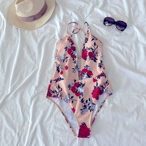 Nude-floral one piece bathing suit. Size: S